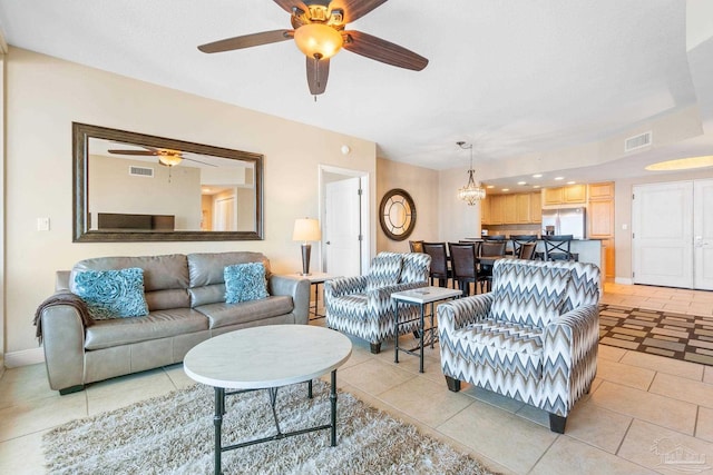 tiled living room featuring ceiling fan