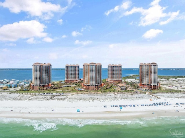 birds eye view of property featuring a water view and a view of the beach