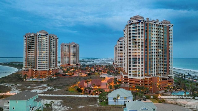 view of property featuring a water view and a view of the beach