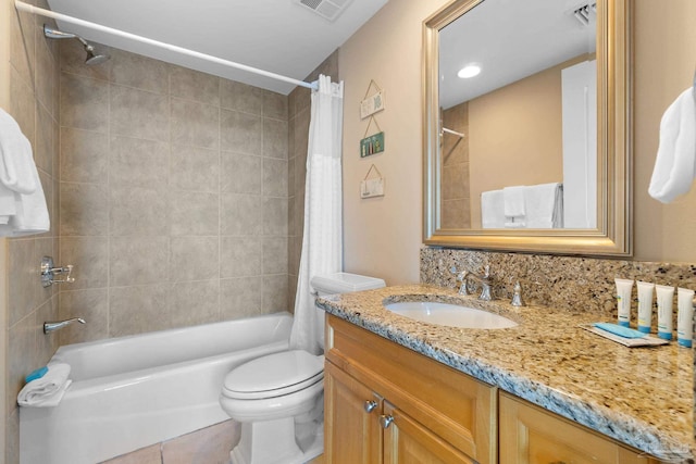 full bathroom featuring vanity, toilet, tile patterned floors, and shower / bath combination with curtain