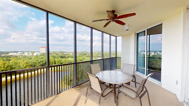 sunroom / solarium with ceiling fan