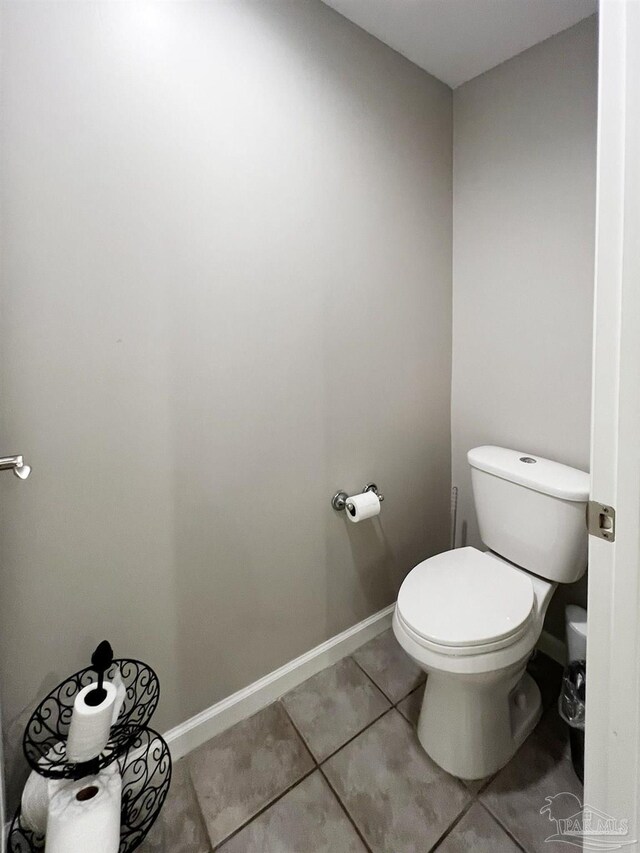 bathroom featuring toilet and tile patterned floors