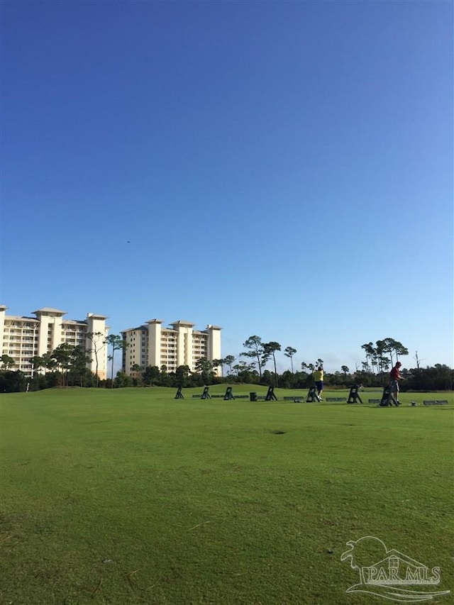 surrounding community featuring a lawn