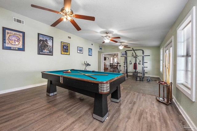 game room featuring pool table, a textured ceiling, hardwood / wood-style flooring, and ceiling fan