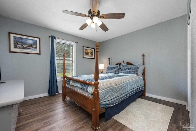 bedroom featuring ceiling fan and dark hardwood / wood-style floors