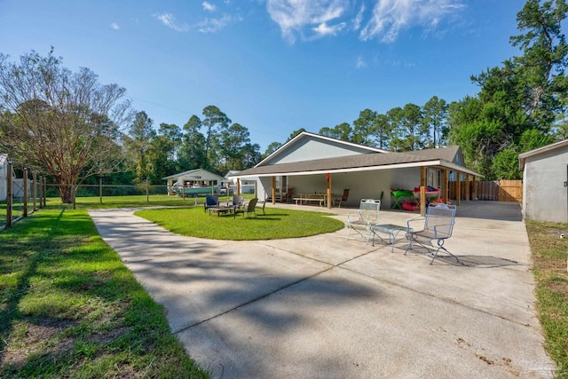 exterior space with a lawn and a patio area