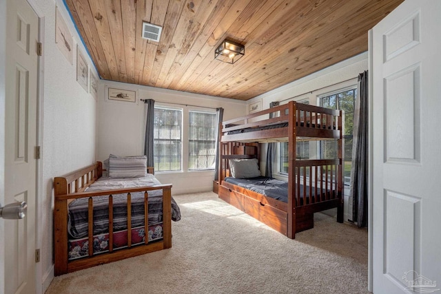 bedroom with light carpet and wooden ceiling