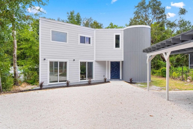 view of front of home with a carport