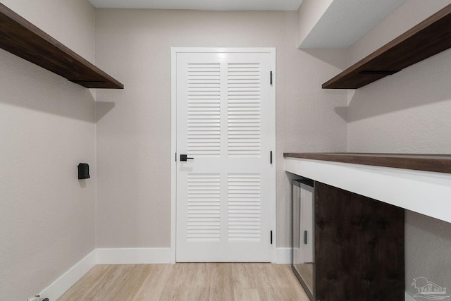 laundry area featuring light hardwood / wood-style flooring