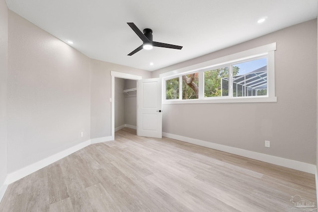 unfurnished bedroom with a closet, ceiling fan, and light hardwood / wood-style floors