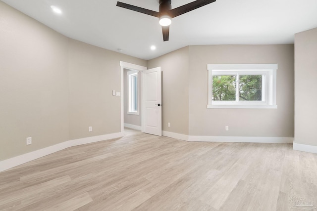 spare room with light hardwood / wood-style flooring and ceiling fan