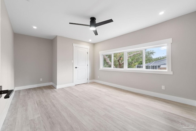 unfurnished bedroom with light wood-type flooring and ceiling fan