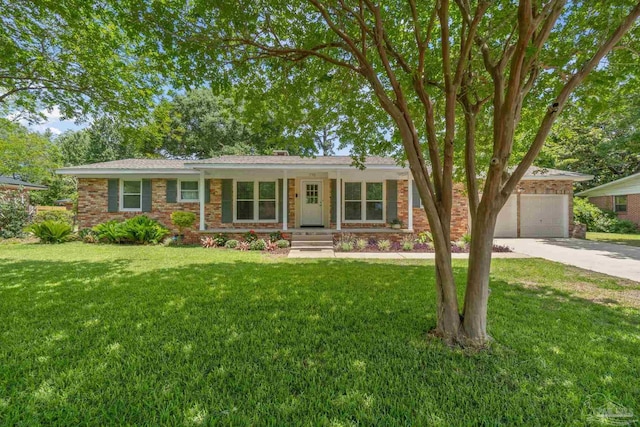 770 Connell Dr, Pensacola, FL 32503 - single story home featuring concrete driveway, a front lawn, brick siding, and an attached garage