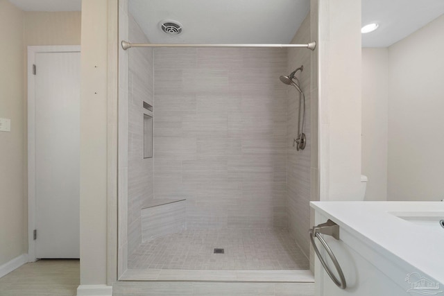 770 Connell Dr, Pensacola, FL 32503 - full bath with a tile shower, vanity, and baseboards