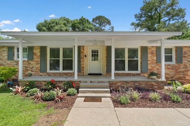 770 Connell Dr, Pensacola, FL 32503 - property entrance featuring covered porch and brick siding