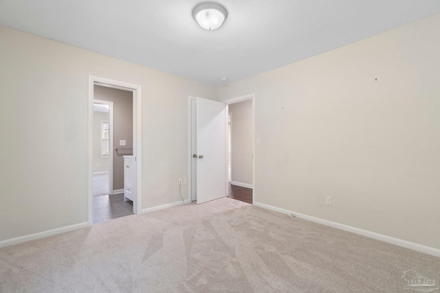 770 Connell Dr, Pensacola, FL 32503 - unfurnished bedroom featuring carpet, baseboards, and connected bathroom