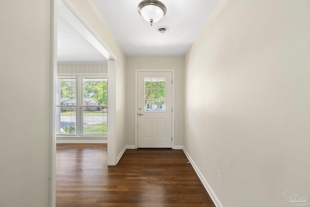 770 Connell Dr, Pensacola, FL 32503 - doorway to outside featuring dark wood-style flooring and baseboards