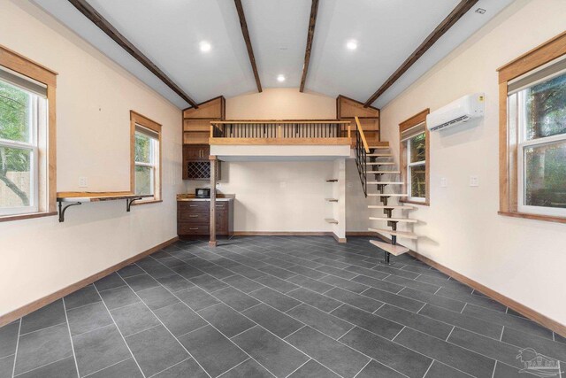 770 Connell Dr, Pensacola, FL 32503 - unfurnished living room featuring a wall mounted air conditioner, plenty of natural light, stairs, baseboards, and recessed lighting