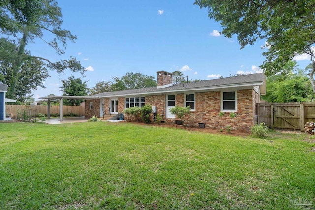 770 Connell Dr, Pensacola, FL 32503 - back of house featuring a patio, a chimney, brick siding, and a gate