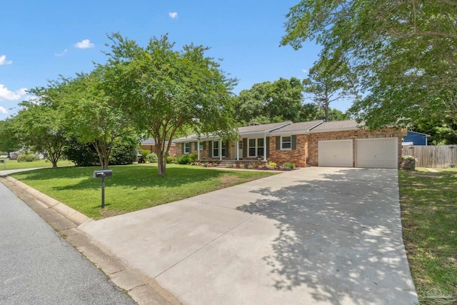 770 Connell Dr, Pensacola, FL 32503 - ranch-style home with an attached garage, concrete driveway, and brick siding