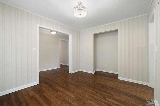 770 Connell Dr, Pensacola, FL 32503 - unfurnished room with crown molding, dark wood-style flooring, baseboards, and wallpapered walls