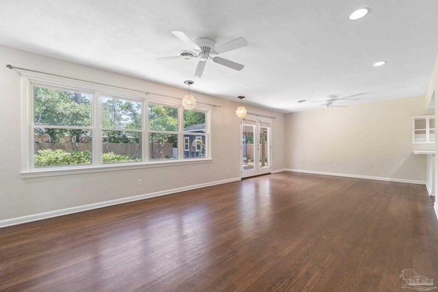 770 Connell Dr, Pensacola, FL 32503 - unfurnished living room featuring a ceiling fan, dark wood-type flooring, baseboards, and recessed lighting