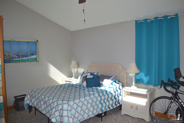 carpeted bedroom with lofted ceiling