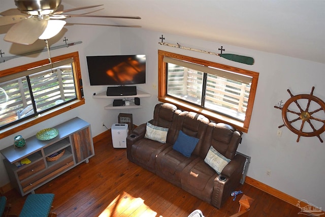 living room featuring ceiling fan, dark hardwood / wood-style flooring, and lofted ceiling