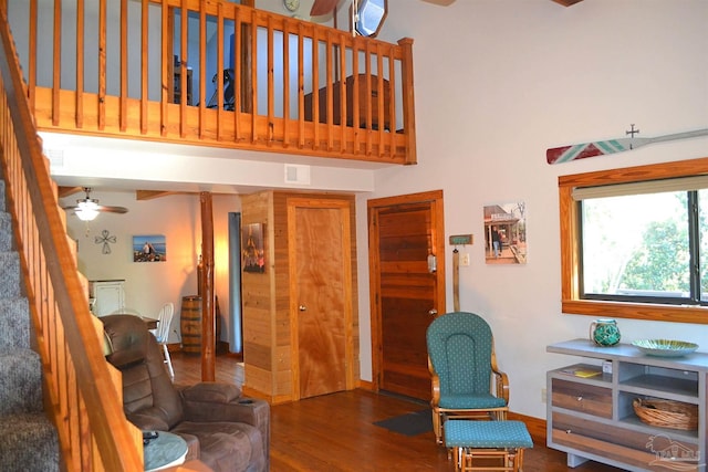 living room with hardwood / wood-style flooring and ceiling fan