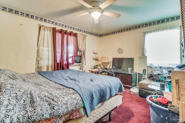 bedroom featuring ceiling fan and carpet floors