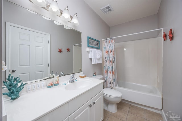 full bathroom featuring vanity, tile patterned floors, toilet, a textured ceiling, and shower / tub combo with curtain