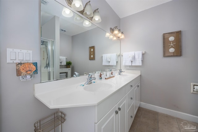 bathroom featuring tile patterned flooring and vanity