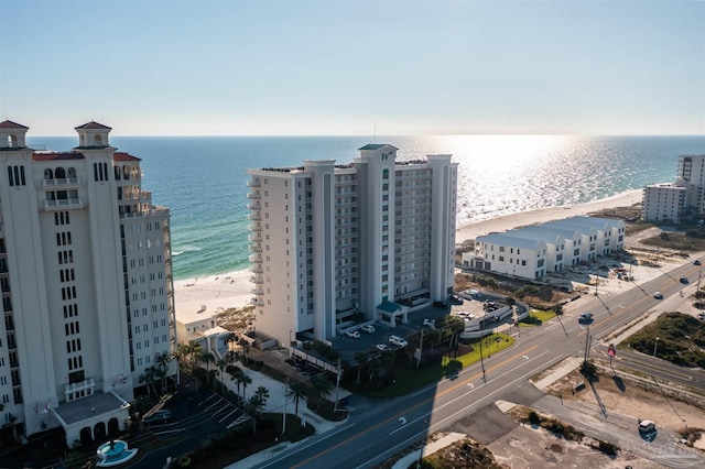 aerial view featuring a water view and a beach view