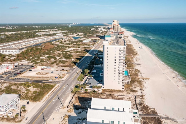 aerial view with a water view and a view of the beach