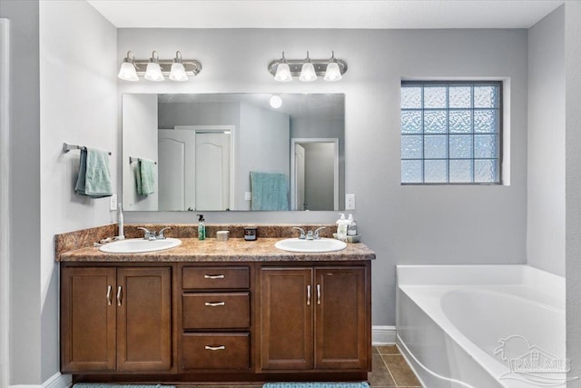 bathroom with vanity and a bathtub