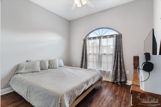 bedroom with dark wood-type flooring and ceiling fan