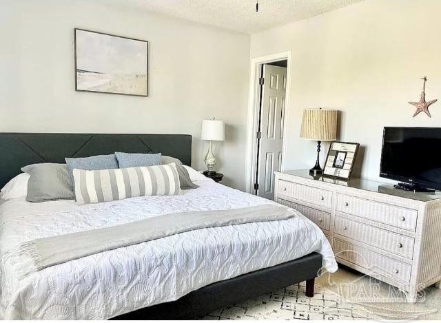 bedroom featuring a textured ceiling