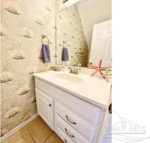 bathroom featuring tile patterned floors and vanity