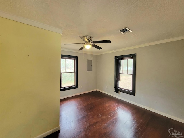 5927 Mitchell Ln, Pensacola, FL 32526 - unfurnished room featuring a wealth of natural light, visible vents, wood finished floors, and ornamental molding