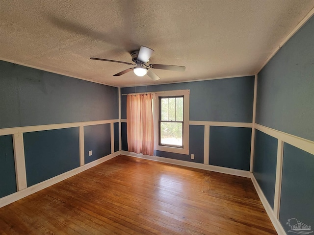 5927 Mitchell Ln, Pensacola, FL 32526 - unfurnished room featuring a decorative wall, ornamental molding, ceiling fan, and wood-type flooring