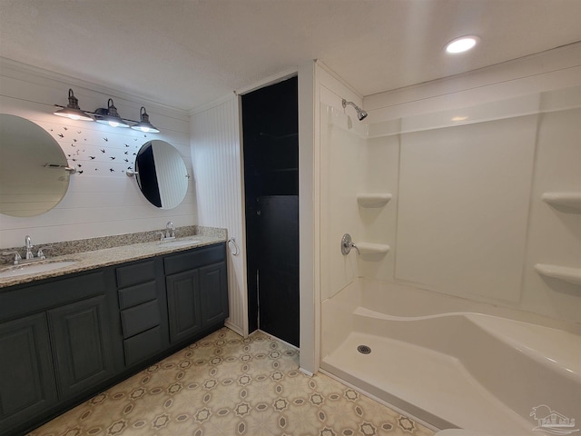 5927 Mitchell Ln, Pensacola, FL 32526 - bathroom with tile patterned flooring, double vanity, walk in shower, and a sink
