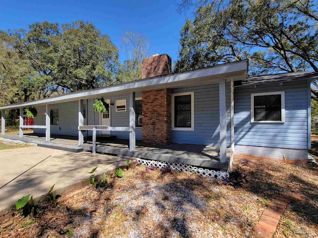 5927 Mitchell Ln, Pensacola, FL 32526 - single story home with a porch and a chimney