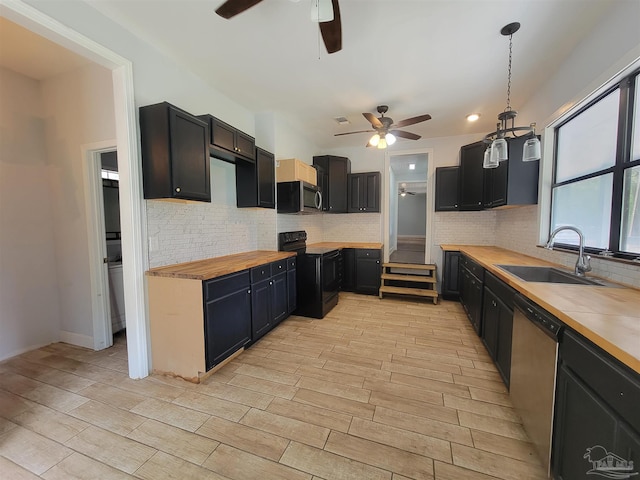 5927 Mitchell Ln, Pensacola, FL 32526 - kitchen featuring a sink, butcher block countertops, a ceiling fan, and stainless steel appliances