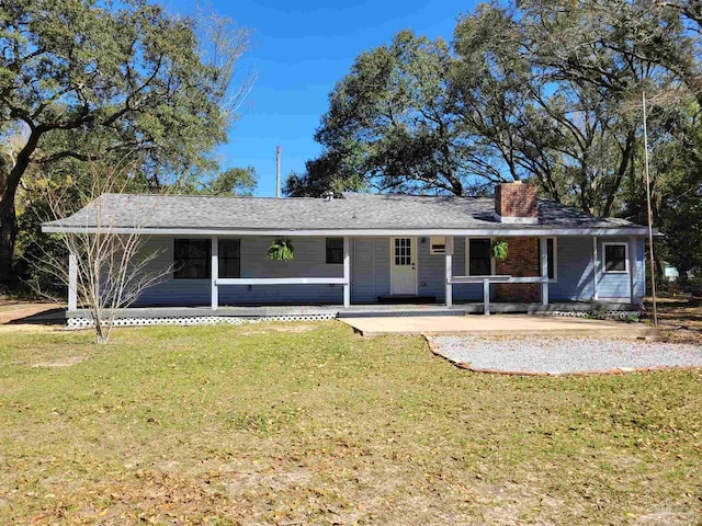 5927 Mitchell Ln, Pensacola, FL 32526 - view of front facade featuring a front yard, a porch, and a chimney