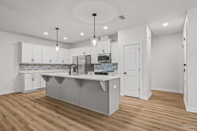 1192 Adrian Way, Milton, FL 32583 - kitchen with stainless steel appliances, light countertops, baseboards, and recessed lighting