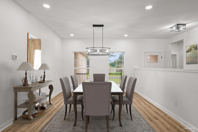 1192 Adrian Way, Milton, FL 32583 - dining area with wood finished floors, a chandelier, recessed lighting, and baseboards