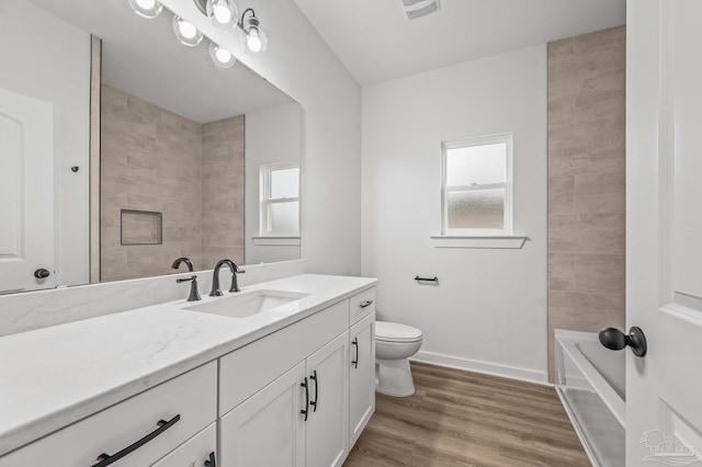 1192 Adrian Way, Milton, FL 32583 - full bathroom with vanity, toilet, wood finished floors, and baseboards