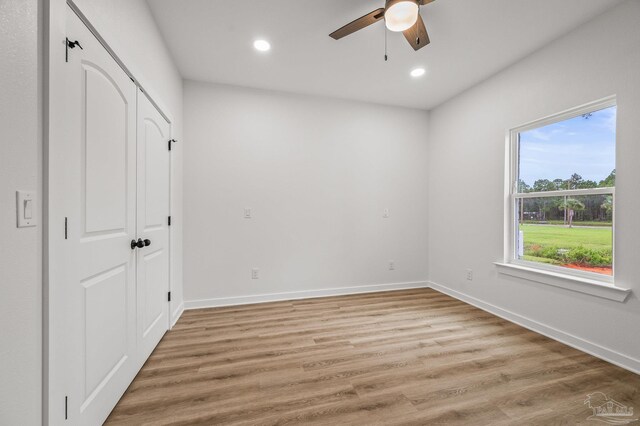1192 Adrian Way, Milton, FL 32583 - unfurnished bedroom featuring recessed lighting, light wood-style flooring, baseboards, a ceiling fan, and a closet