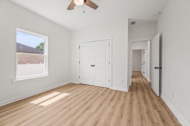 1192 Adrian Way, Milton, FL 32583 - unfurnished bedroom featuring light wood-type flooring, a closet, and baseboards