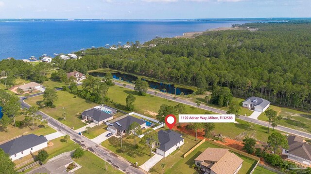 1192 Adrian Way, Milton, FL 32583 - aerial view of property and surrounding area with a forest, a large body of water, and nearby suburban area